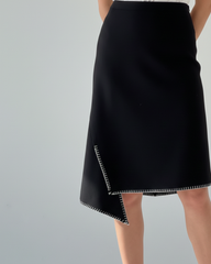 crepe skirt close-up showing contrast stitch detail