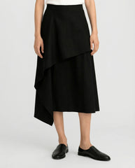 Modern black draped linen skirt styled on model