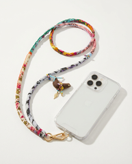 Close up of handmade textile phone strap with beaded charm