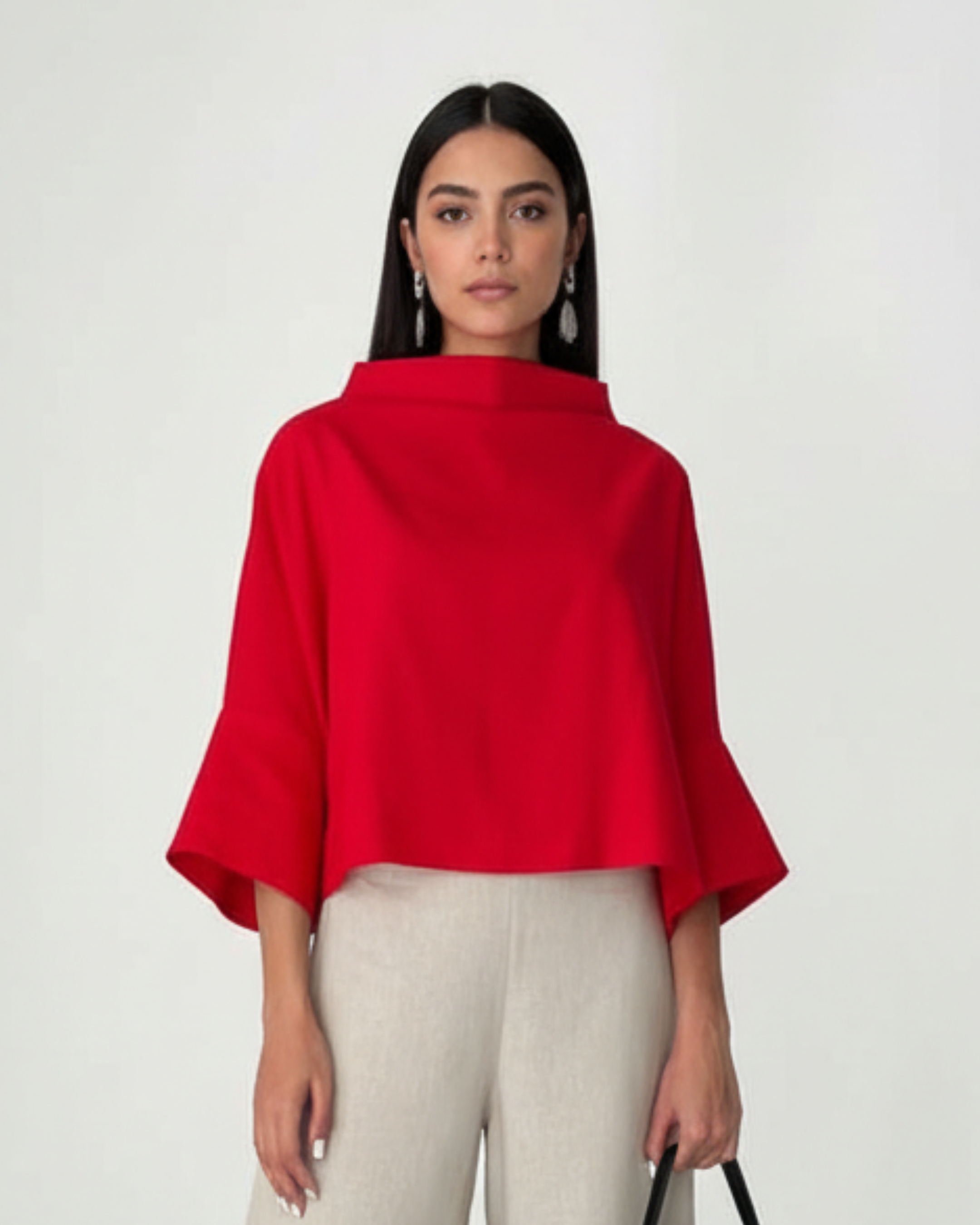 Red linen blouse cropped length with architectural sleeves, studio shot