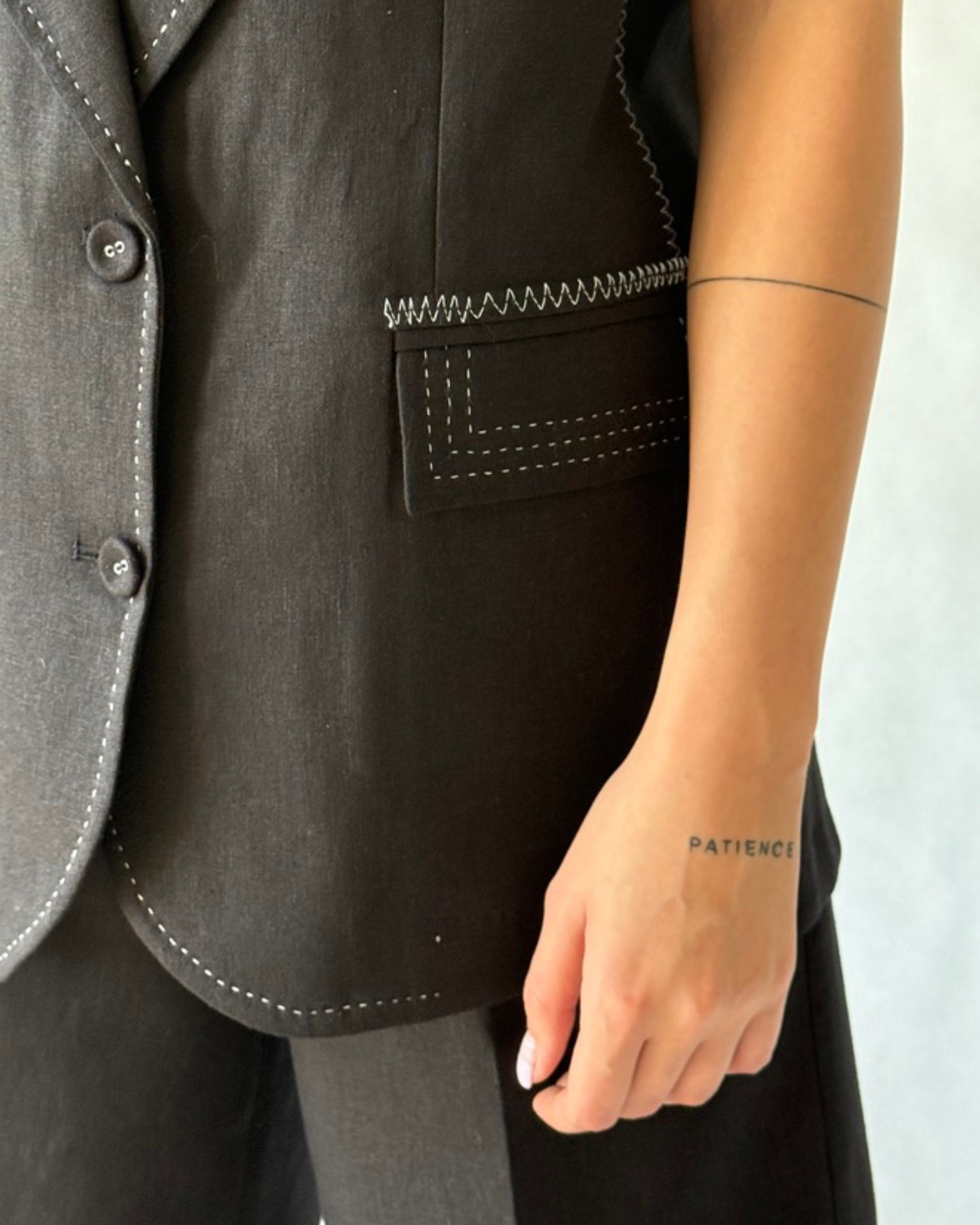 modern black tailored vest with lapel collar