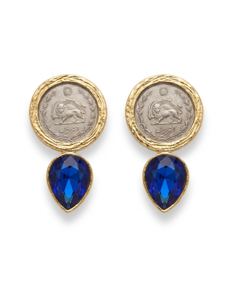 Earrings with coin-like tops and blue teardrop stones on a white background