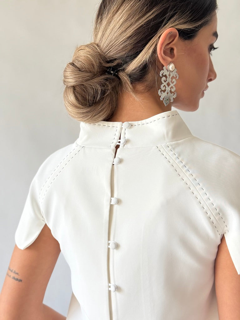 White tailored women’s top with decorative neckline