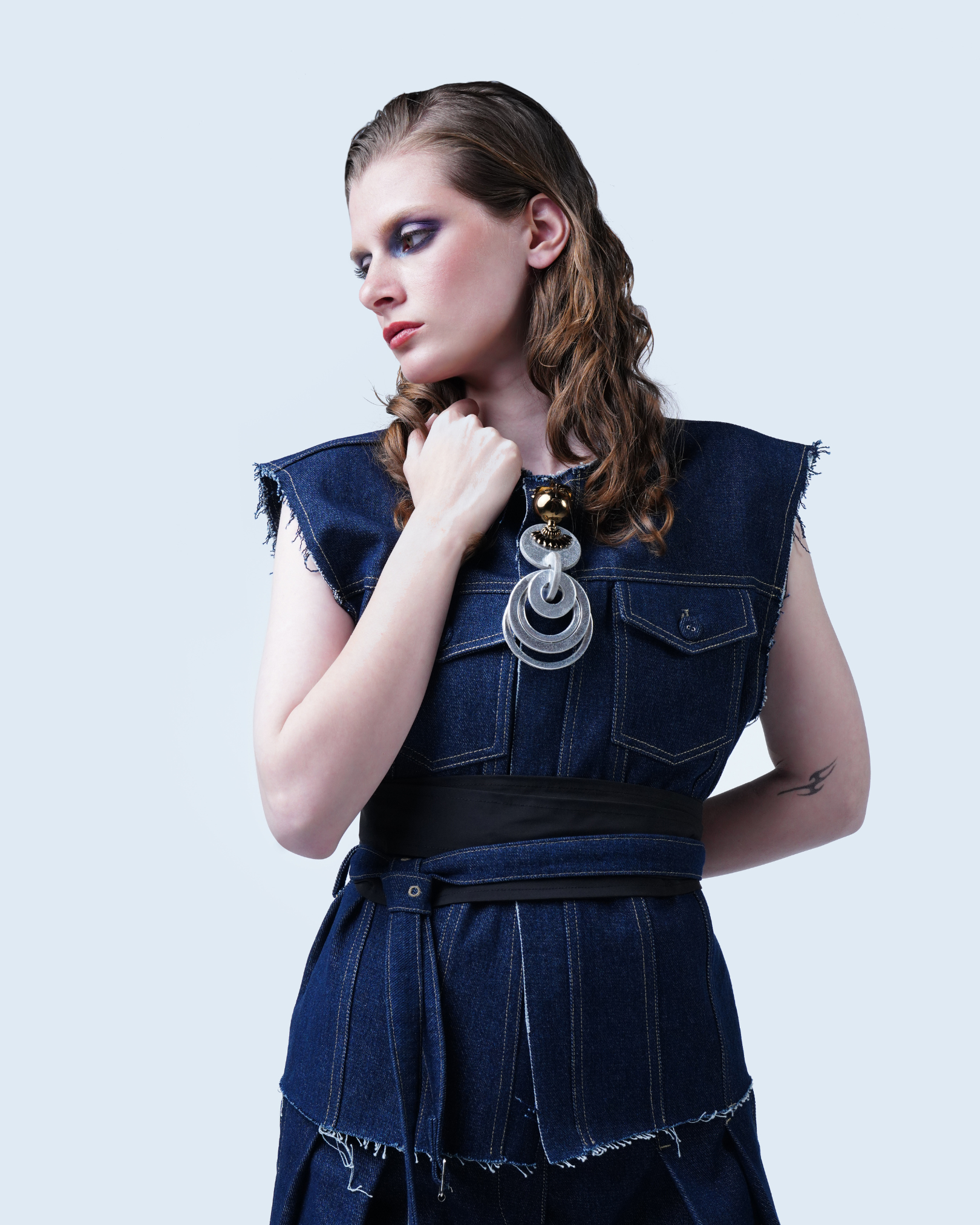 Raw-edge sleeveless denim top with belt detail