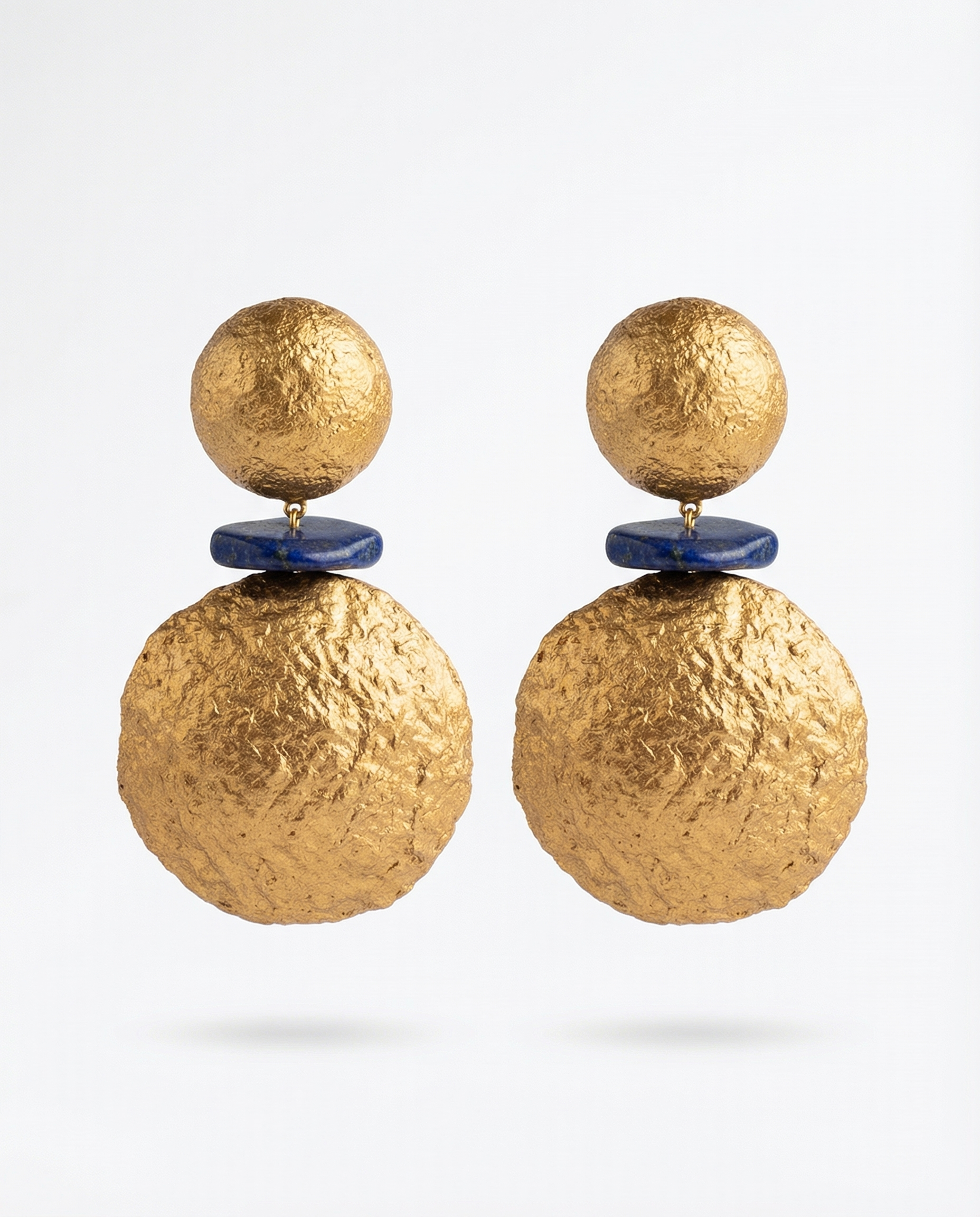 Bold gold papier-mâché statement earrings with blue stone detail