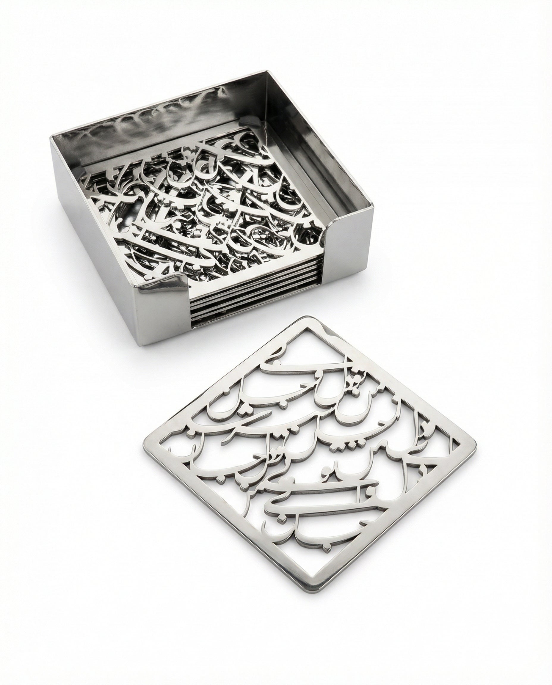 Set of metal coasters with intricate designs in a box on a white background