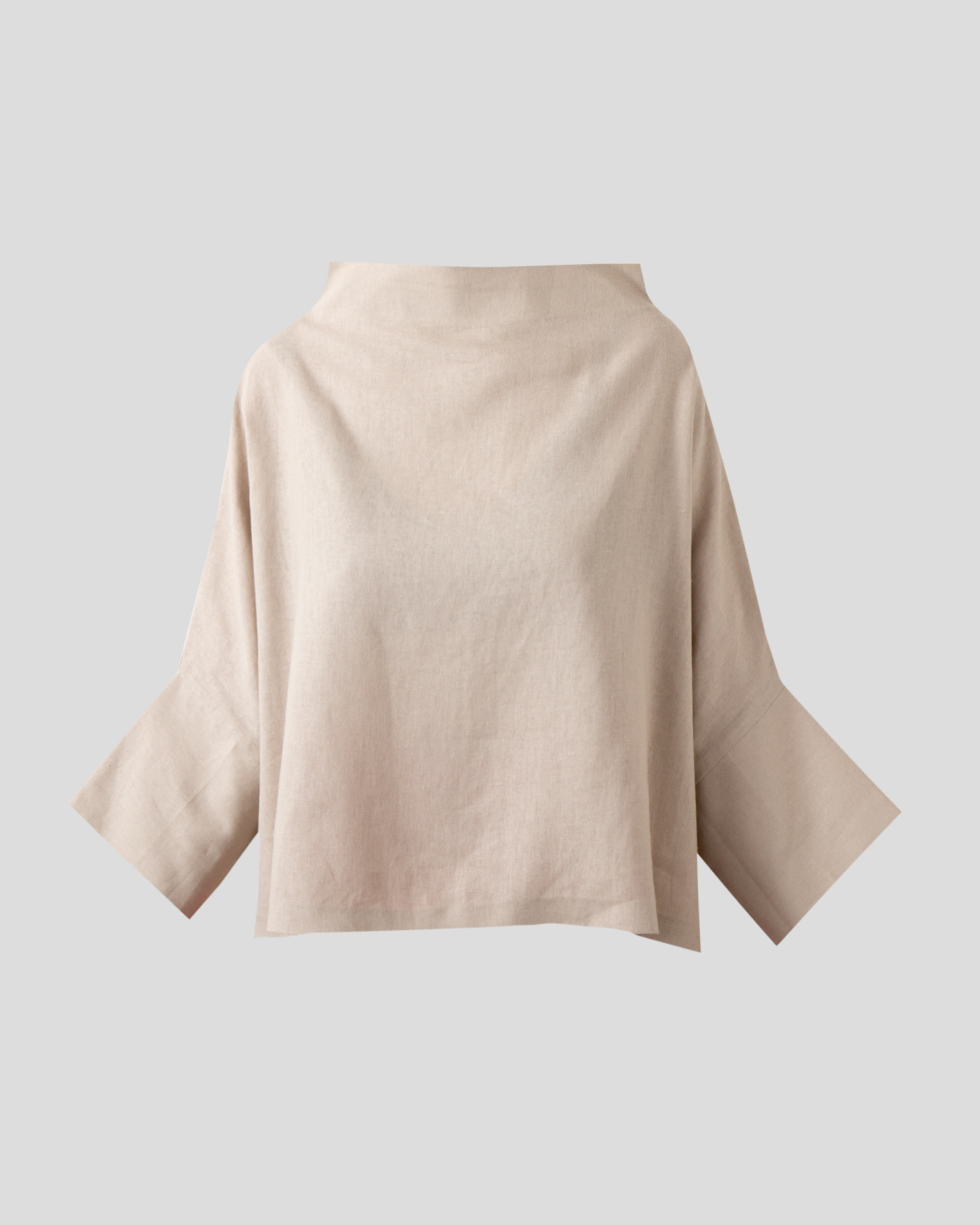 Close front view of beige linen blouse showing soft funnel neckline