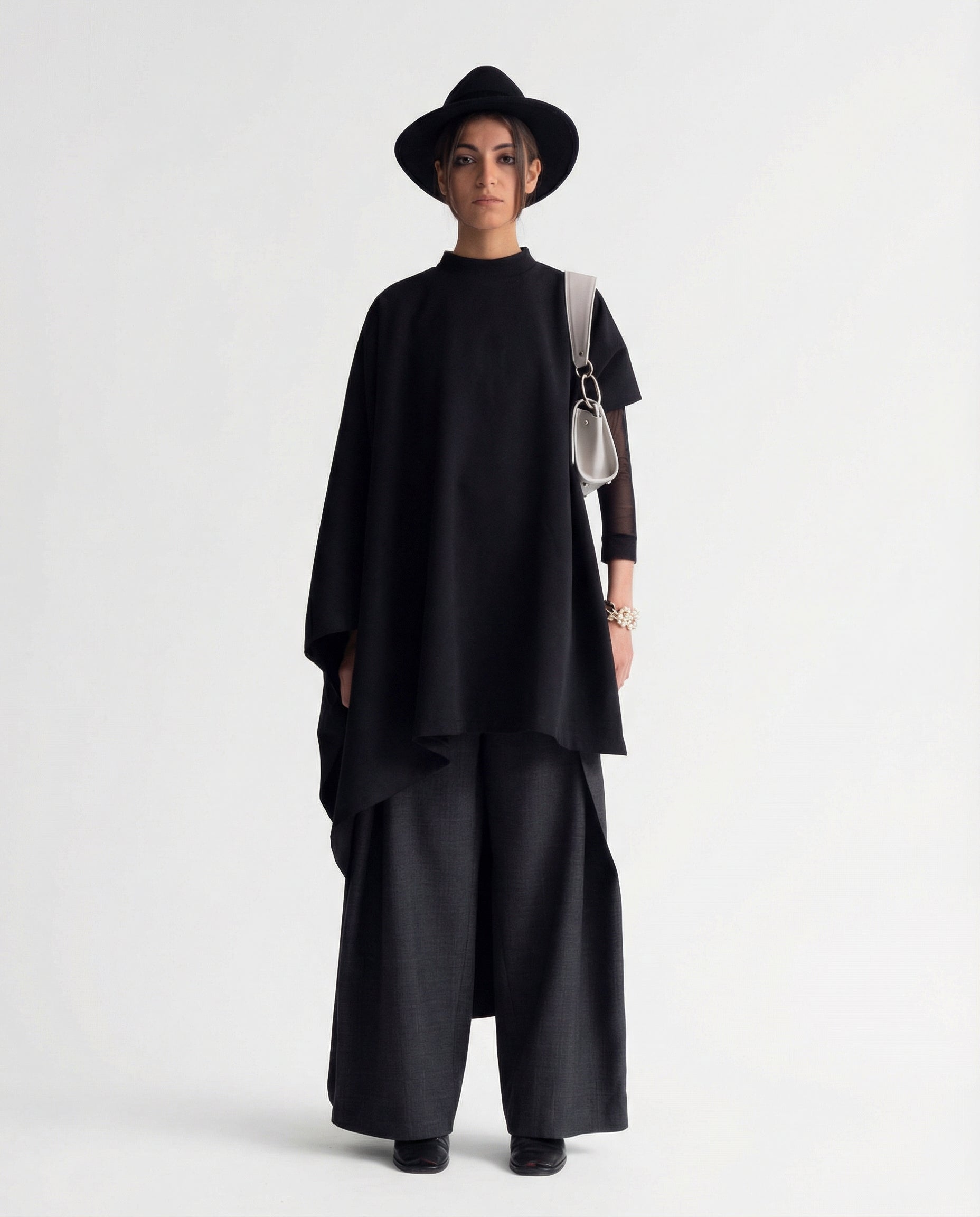 Black sculptural cape front full length view