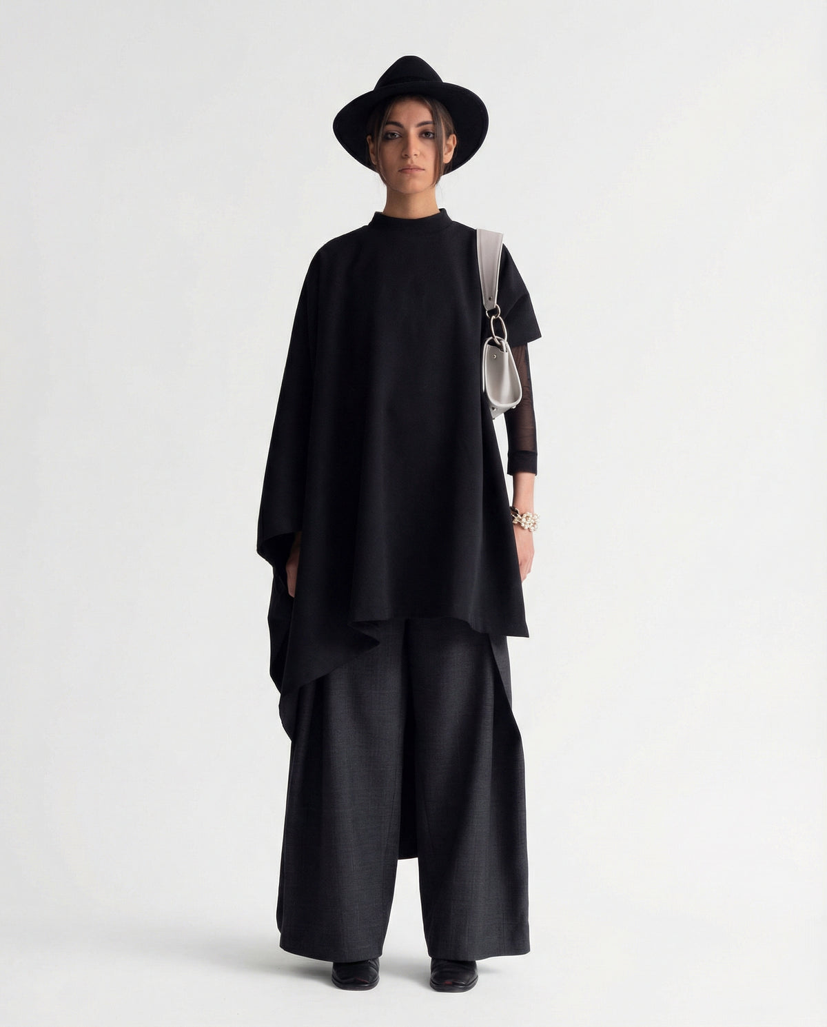 Black sculptural cape front full length view