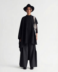 Black sculptural cape front full length view