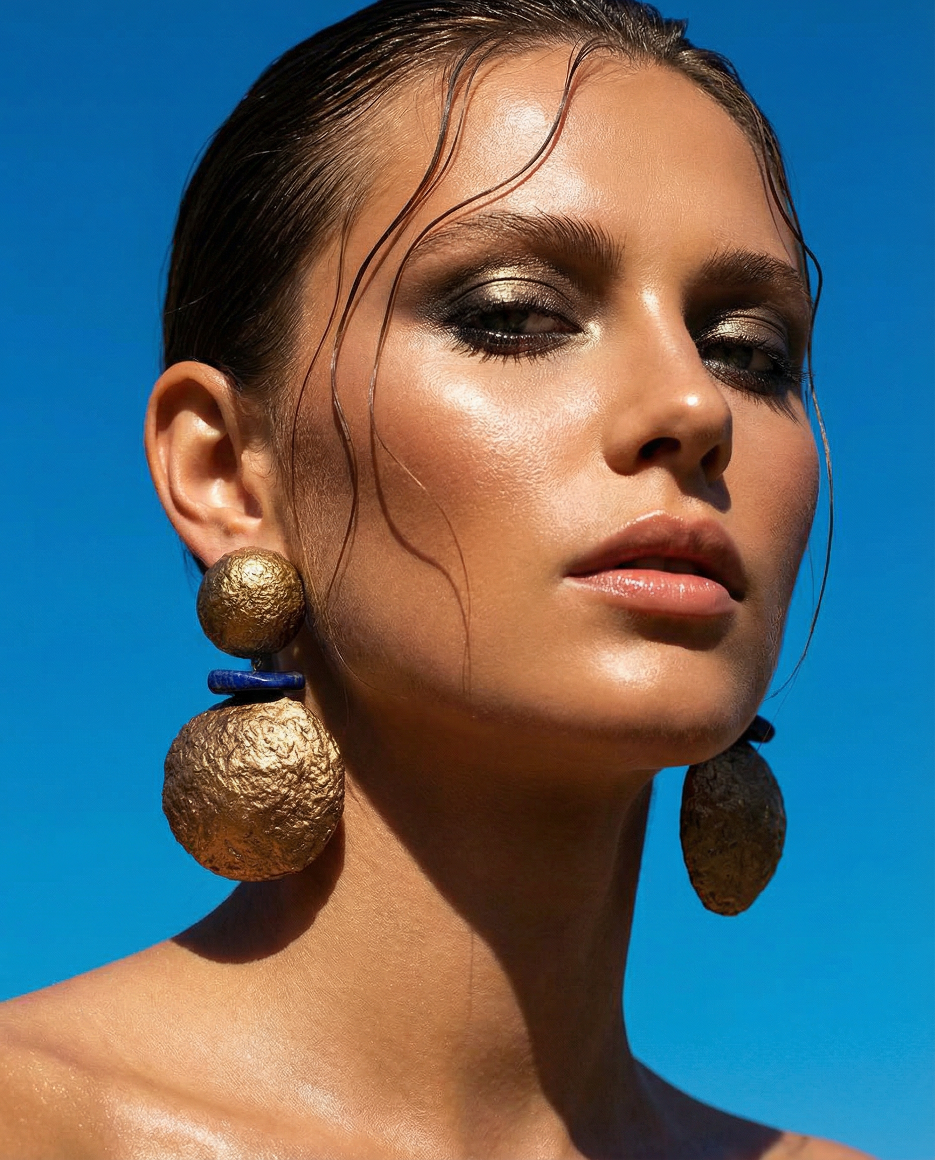 Handmade sculptural earrings in gold and navy