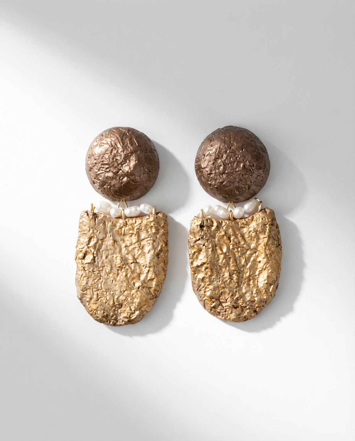 handmade gold sculptural earrings with pearls