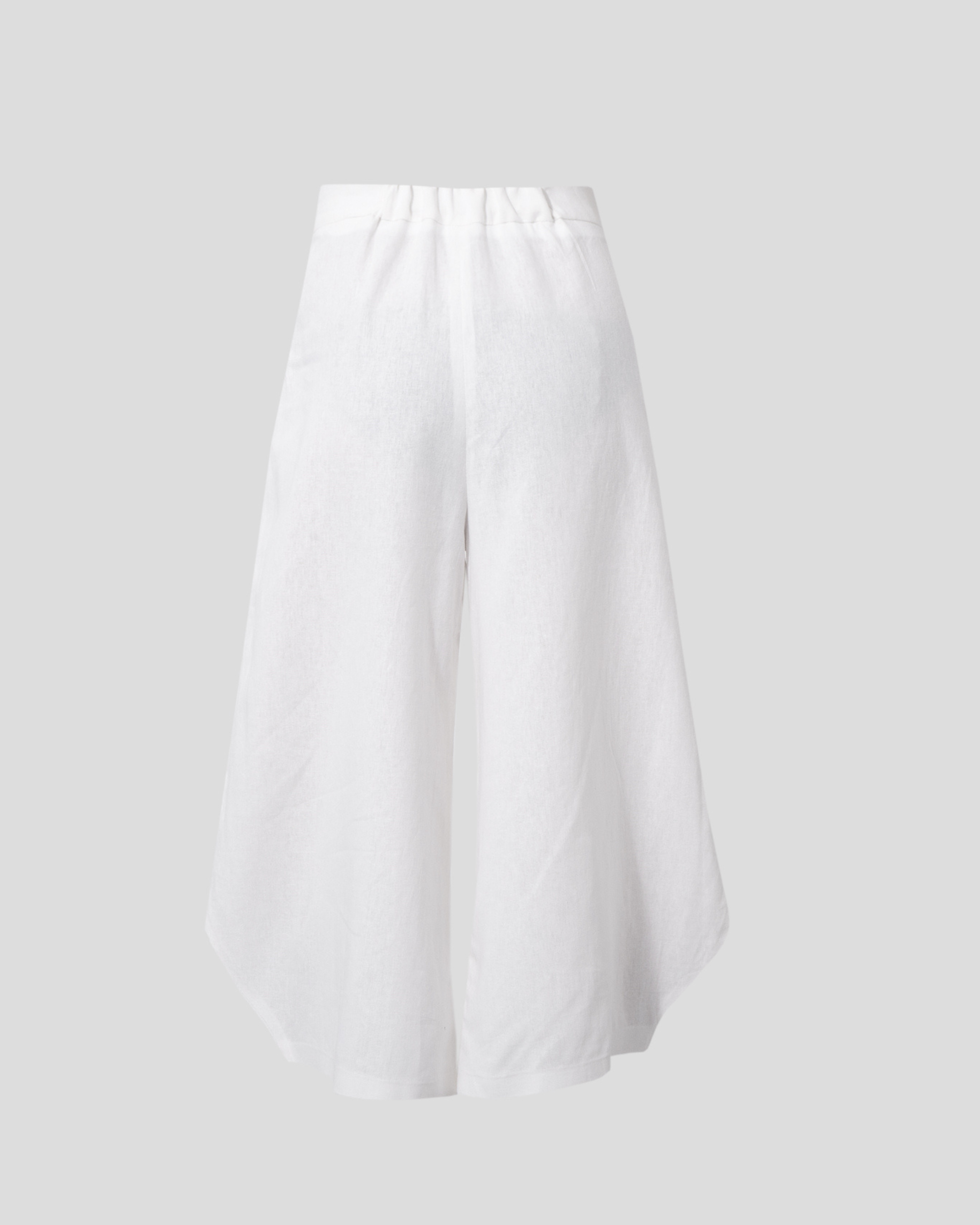 sculptural round hem detail on red linen pants