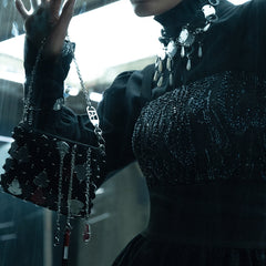 Iranian-inspired sculptural handbag with triangular pieces